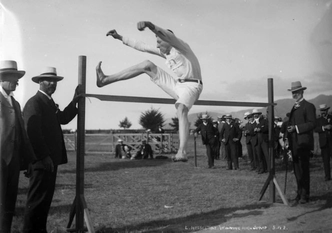 L Hesseltine winning the high jump, Nelson