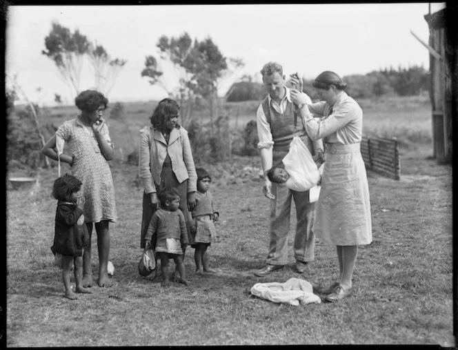 District nurse weighing a baby, Northland