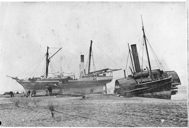 The steam ship "William Misken" and the paddlesteamer tug " Lioness", ashore at Hokitika