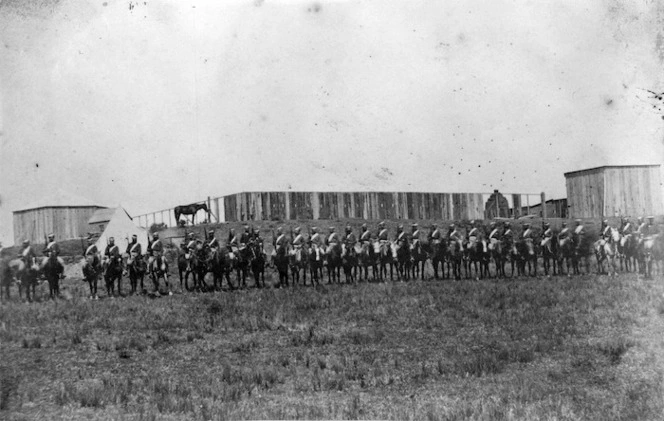 Mounted troops alongside the stockade at Ruataniwha, during the New Zealand Wars