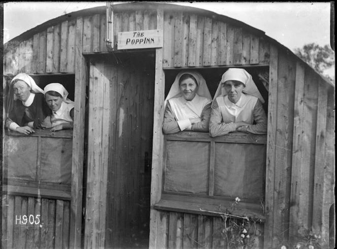 Nurses look out of the windows of the New Zealand Stationary Hospital, Wisques, France, during World War 1
