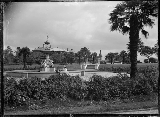 Albert Park, Auckland, showing large fountain, gardens, and a statue in the background.