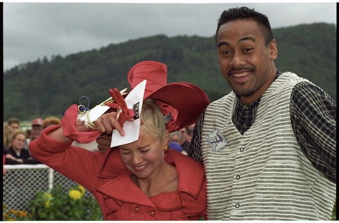 Fashion award winner Carolyn Todd with All Black Jonah Lomu at Wellington Cup Day, Trentham - Photograph taken by Ross Giblin