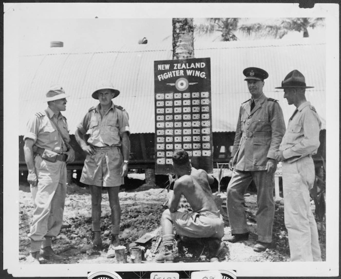 Group around the New Zealand Fighter Wing score board, Odonga (New Georgia), Solomon Islands