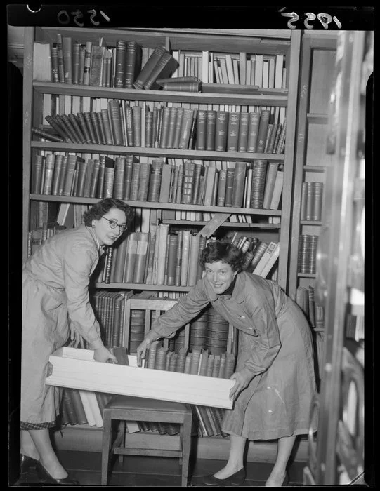 Staff of the Alexander Turnbull Library moving the book collection out of the Bowen Street building for the restrengthening of 1955-1957