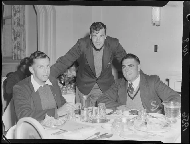 Mr DE Grant, Mr DJ McKenzie and Ian Clarke, Waikato Rugby Union Football players, having dinner in Wellington