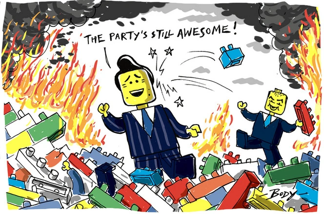 Simon Bridges as a Lego Minifigure saying "the party's still awesome" as Jamie Lee Ross throws a Lego brick at him, and flames rage