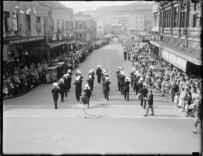 Brass band marching in Mercer Street, Wellington