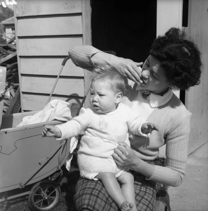 Woman with a child on her knee