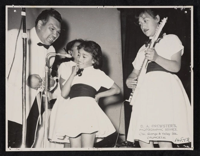 Johnny Cooper on stage with three unidentified contestants