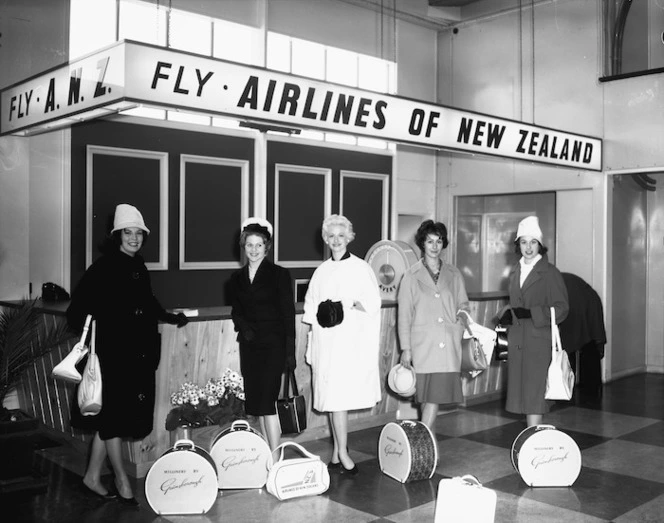 Women at Paraparaumu Airport, alongside the South Pacific Airlines of New Zealand counter