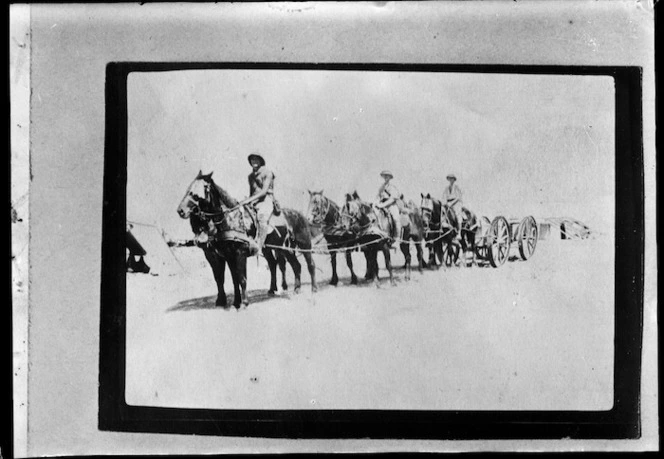 World War I soldiers drive a horse team