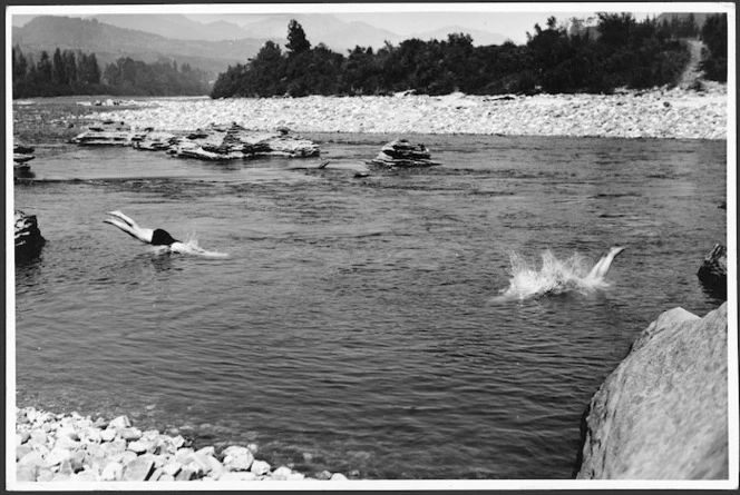 People diving into the Aorere River