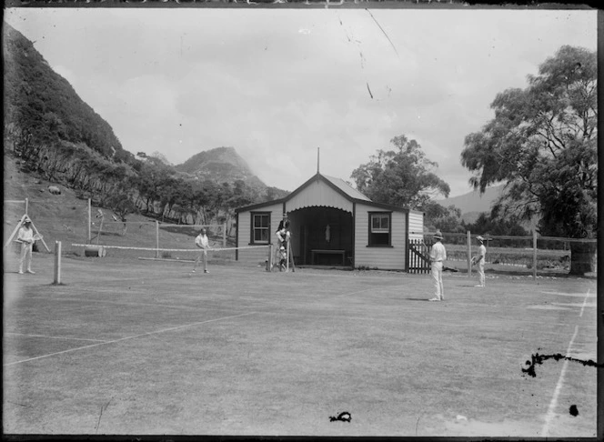 Men playing tennis, Te Araroa, New Zealand