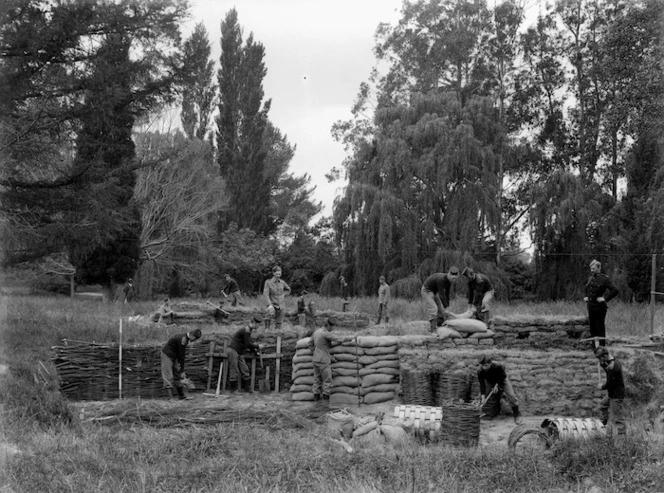 Military volunteers building earthworks