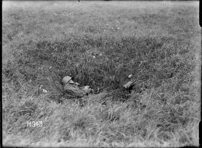 A dead German soldier in a shell hole on the Western Front, World War I