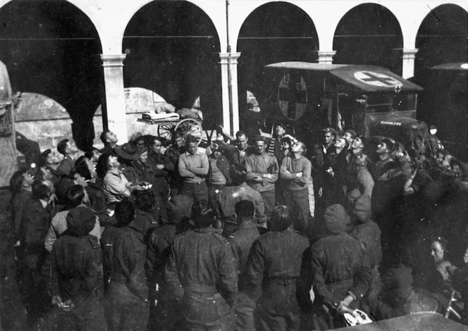 Ross, L H, fl 1945? : Soldiers playing the gambling game of Two-up at Faenza, Italy