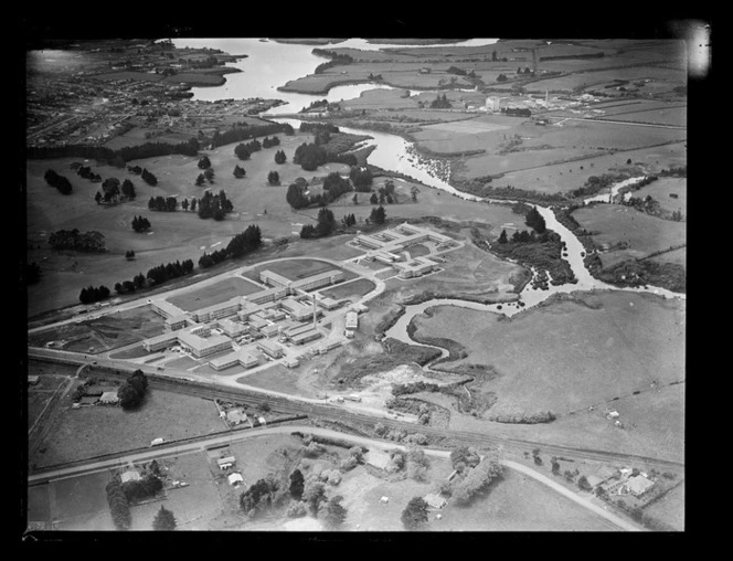 Middlemore Hospital with railway line in foreground and the Tamaki River beyond, Papatoetoe, Auckland