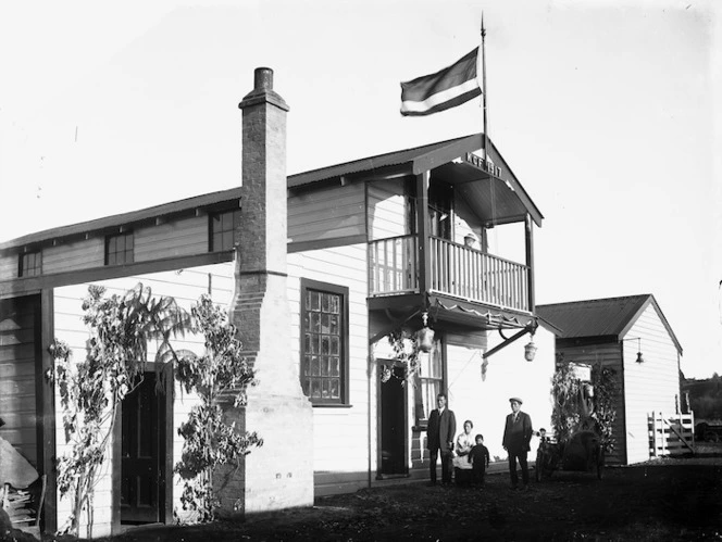 Members of the Ngan Fore family outside their house in the Kwong Chong Garden, Wanganui