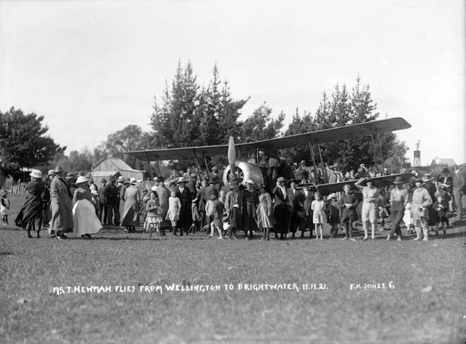 Group surrounding the first aircraft to land at Nelson