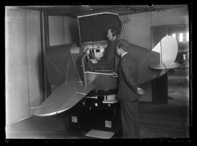 Two unidentified airmen with a Link Trainer flight simulator, Flying Instructor Training School, Hobsonville RNZAF base