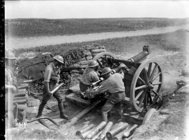 A New Zealand 18 pounder gun in action at Beaussart, France, during World War I