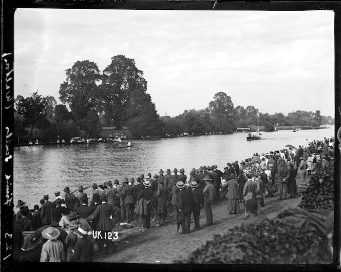 Spectators watch the finish of a rowing race, Walton-on-Thames