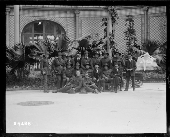A group of World War I New Zealand soldiers in front of a statue in Paris