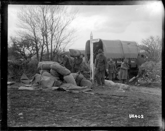 World War I New Zealand army truck loading sacks, England