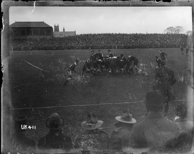 Half back passes the ball at an inter services rugby match, London