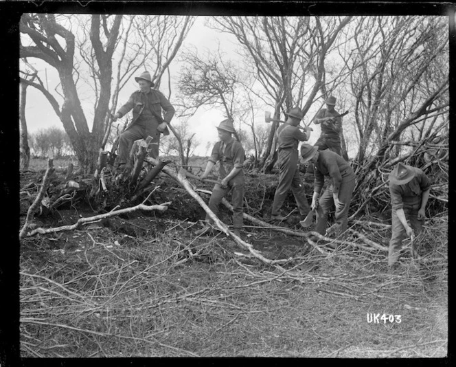 New Zealand soldiers cutting wood in England