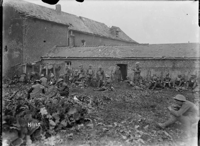 New Zealand soldiers eating after an attack near Solesmes, France, World War I