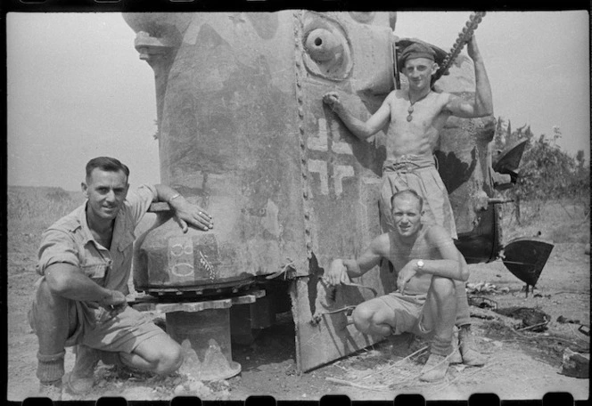 New Zealanders by a recaptured New Zealand Sherman tank, World War II, Italy - Photograph taken by George Kaye