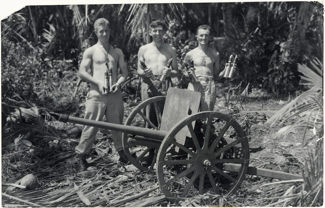 New Zealand soldiers Lepine, Gower and Finlayson with Japanese mountain gun during World War II, Treasury Islands, Solomon Islands