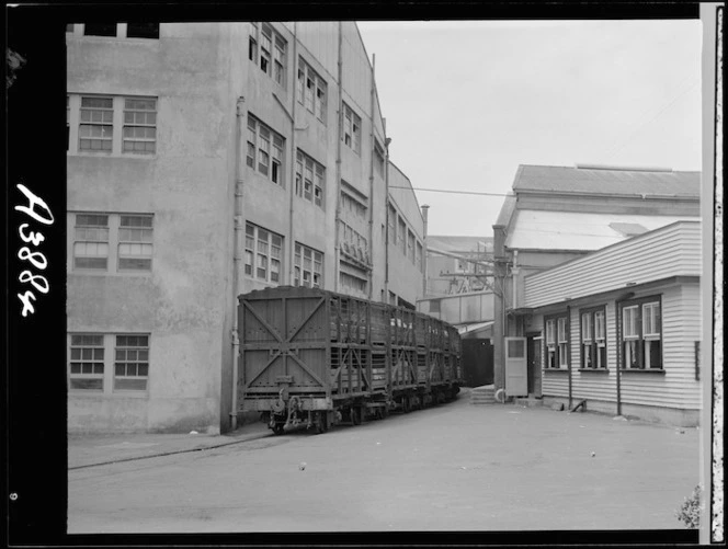Railway wagon of stock arriving at the Westfield Freezing Works, Otahuhu, Auckland - Photograph taken by W Walker