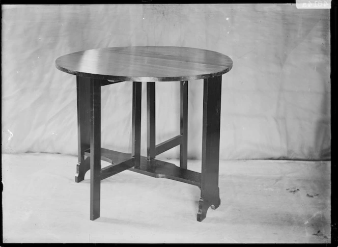 Round drop-leaf table in art nouveau style