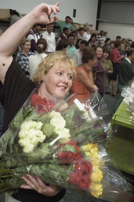 Terese Walding of Daisy A Day bids for a bunch of flowers - Photograph taken by John Nicholson