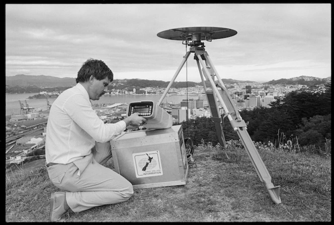 Surveyor checks GPS equipment, Wellington - Photograph taken by Jon Hargest