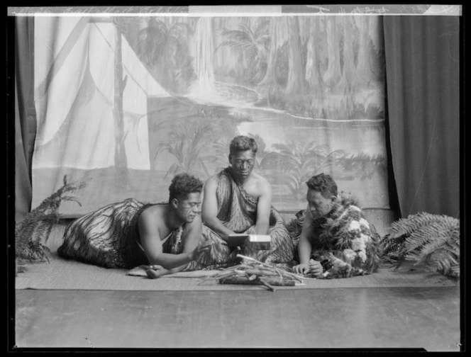 Tableau, re-enacting Maori reading a bible after contact with European Christian missionaries, at the East and West Missionary Exhibition, Wellington Town Hall