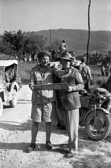 New Zealand Prime Minister Peter Fraser and General Freyberg study a map near Sora, Italy, during World War 2