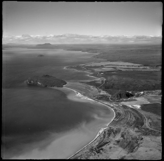 View of eastern side of Lake Taupo with Stump Bay and the Motuoapa Peninsula, with State Highway 1 and the settlement of Motuoapa to Motutaiko Island beyond,