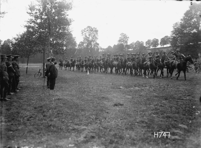 Soldiers of the Otago Mounted Rifles parading past William Massey at Oessy, France