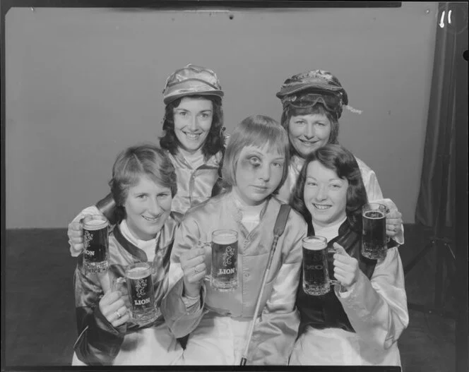 Woman Jockeys drinking Lion beer