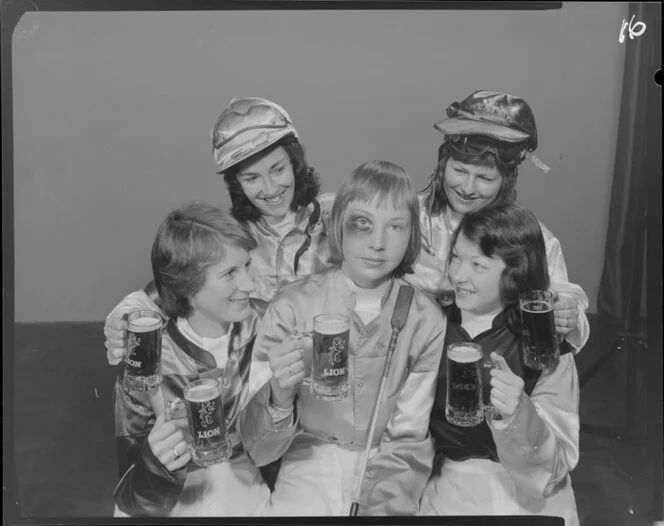 Woman Jockeys drinking Lion beer