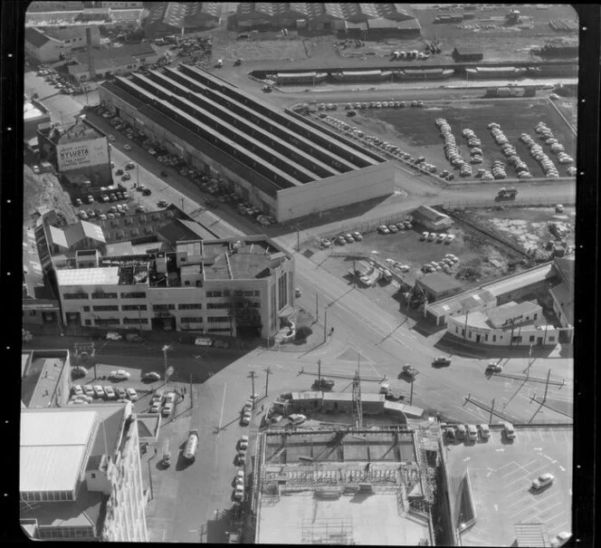 Auckland businesses etc featuring a fire-damaged building with an official crest