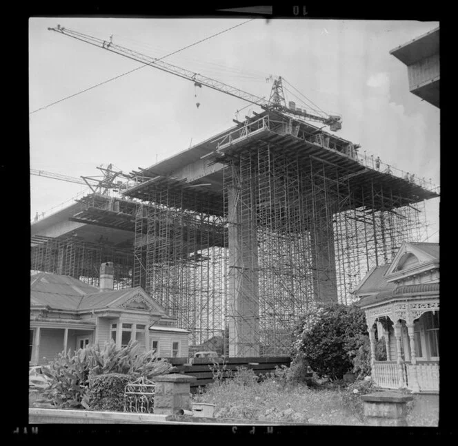 Construction of southern motorway viaduct, Newmarket, Auckland, including house used as site office