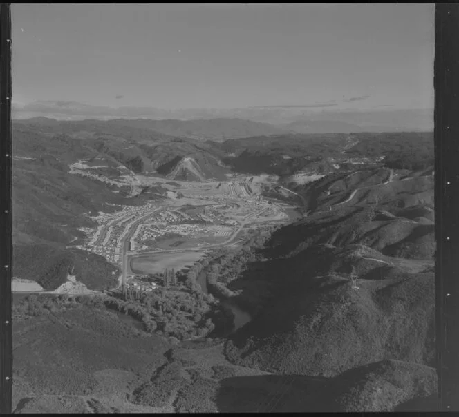 Matahina Hydroelectricity Scheme, showing construction of earth dam, with penstocks