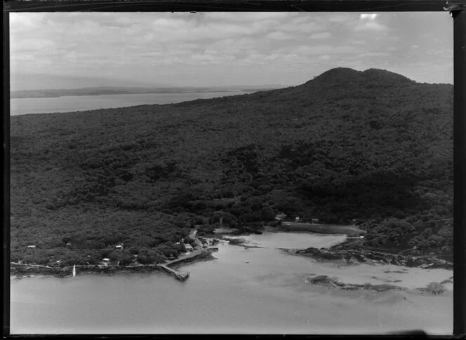 Main wharf at Rangitoto Island, with baches, and with view towards central cone