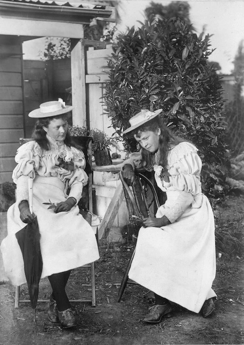 Two women photographed outside