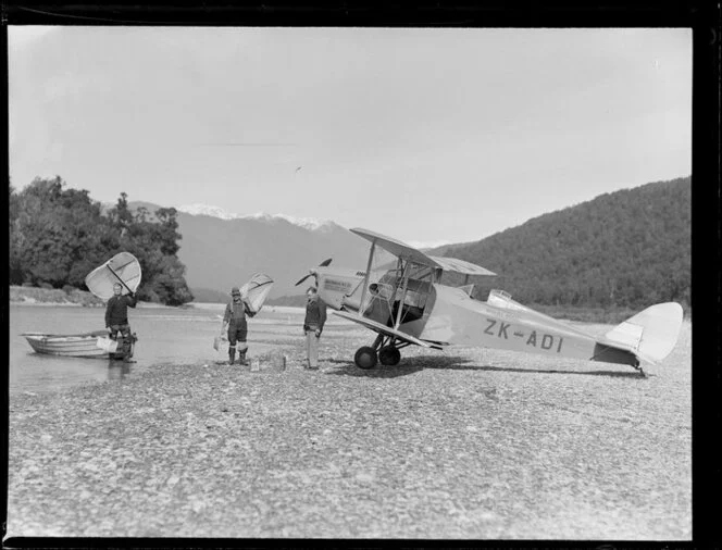 Fox Moth aircraft, belonging to Air Travel N Z Ltd, at Paringa River, South Westland, with fishers